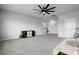Large bonus room featuring plush carpet, ceiling fan, storage unit, and neutral paint at 13194 Magnolia Valley Dr, Clermont, FL 34711
