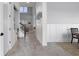 Inviting entryway features shiplap walls, light wood floors, and a view of the living room at 13194 Magnolia Valley Dr, Clermont, FL 34711