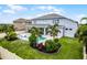 Charming home with a backyard featuring a pool, patio, and lush landscaping, creating a desirable outdoor space at 13194 Magnolia Valley Dr, Clermont, FL 34711