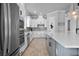 Well-equipped kitchen features modern appliances, a large island, and stylish pendant lighting fixtures at 13194 Magnolia Valley Dr, Clermont, FL 34711