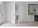 Bright living space with double doors, stylish wet bar, and open access to other areas at 13194 Magnolia Valley Dr, Clermont, FL 34711
