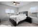 Spacious bedroom with soft carpets, large windows, and dark wood furniture at 13194 Magnolia Valley Dr, Clermont, FL 34711
