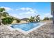 Refreshing swimming pool with an integrated spa, surrounded by a lush backyard at 13194 Magnolia Valley Dr, Clermont, FL 34711
