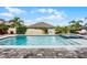 Beautiful backyard swimming pool and spa with brick patio and lush landscaping at 13194 Magnolia Valley Dr, Clermont, FL 34711