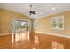 Bright and open living room with gleaming hardwood floors and plenty of natural light at 14 Camino Real Blvd # 14, Howey In The Hills, FL 34737