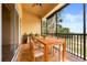 Covered outdoor patio with a dining table and chairs, perfect for entertaining at 14 Camino Real Blvd # 14, Howey In The Hills, FL 34737