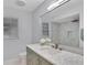 Modern bathroom featuring marble countertop, elegant fixtures, and a spacious walk-in shower at 140 Sweet Bay Cir, Lake Mary, FL 32746