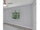 Bedroom with neutral walls, carpeted floors, a ceiling fan, and a window view of greenery at 140 Sweet Bay Cir, Lake Mary, FL 32746
