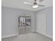 Bedroom with neutral walls, carpeted floors, sliding glass door overlooking the patio and a ceiling fan at 140 Sweet Bay Cir, Lake Mary, FL 32746