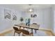 Dining room featuring modern light fixture, wood floors, and contemporary decor at 140 Sweet Bay Cir, Lake Mary, FL 32746