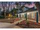 Inviting home with brick facade, well-lit landscaping, and a covered porch perfect for evening relaxation at 140 Sweet Bay Cir, Lake Mary, FL 32746