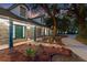 Inviting home exterior with a manicured front yard, pathway lighting, and covered front porch at 140 Sweet Bay Cir, Lake Mary, FL 32746