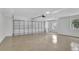 Bright, spacious garage with an epoxy floor, garage door, and natural light from a side window at 140 Sweet Bay Cir, Lake Mary, FL 32746