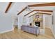 Bright living room featuring a brick fireplace and vaulted ceiling with wood beams at 140 Sweet Bay Cir, Lake Mary, FL 32746