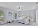 Bright bedroom with large windows and a comfortable, stylish bed at 140 Sweet Bay Cir, Lake Mary, FL 32746