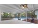 Covered patio featuring a ceiling fan, tile floor, and a view of the sparkling pool and yard at 140 Sweet Bay Cir, Lake Mary, FL 32746
