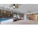 Enclosed patio showcasing a ceiling fan, and views of the yard and pool at 140 Sweet Bay Cir, Lake Mary, FL 32746