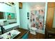 Eclectic bathroom featuring a uniquely decorated vanity, playful shower curtain, and tiled flooring at 1405 Periwinkle Ave, Deland, FL 32724