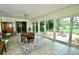 Well lit dining room with table, chairs and views to the backyard at 1405 Periwinkle Ave, Deland, FL 32724