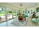 Bright dining room with views of backyard with a table and chairs at 1405 Periwinkle Ave, Deland, FL 32724