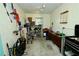 Organized garage space with ample storage shelves, a workbench, and tools at 1405 Periwinkle Ave, Deland, FL 32724