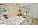 Bedroom with sliding glass door access to patio and ensuite at 1405 Periwinkle Ave, Deland, FL 32724