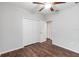 Cozy bedroom with closet, ceiling fan and wood-look flooring at 141 Sandestin Dr, Haines City, FL 33844