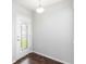 Inviting entryway with a decorative glass door and stylish hardwood flooring at 141 Sandestin Dr, Haines City, FL 33844