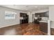 Charming kitchen features dark wood cabinets, stylish countertops, and modern black appliances at 141 Sandestin Dr, Haines City, FL 33844