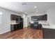 Charming kitchen features dark wood cabinets, stylish countertops, and modern black appliances at 141 Sandestin Dr, Haines City, FL 33844