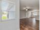Bright living room showcasing hardwood floors and large windows for natural light at 141 Sandestin Dr, Haines City, FL 33844