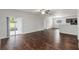 Spacious living room featuring hardwood floors and sliding glass doors to the backyard at 141 Sandestin Dr, Haines City, FL 33844
