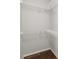 Walk-in closet with installed wire shelving and wood-look flooring at 141 Sandestin Dr, Haines City, FL 33844