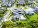 Stunning aerial view of a modern home, with a pool, a solar panel roof, and manicured landscaping at 14106 Eliot Ave, Orlando, FL 32827