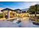 Lush backyard with a modern pool, sun loungers, and an outdoor dining area perfect for entertaining at 14106 Eliot Ave, Orlando, FL 32827