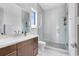 Bright, modern bathroom with walk-in glass shower and marble vanity at 14106 Eliot Ave, Orlando, FL 32827