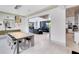 Elegant dining area featuring a modern table and chairs, stylish lighting, and an open view into the adjacent living spaces at 14106 Eliot Ave, Orlando, FL 32827
