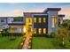 Contemporary two-story home with modern architecture, professional landscaping, and a brick walkway at 14106 Eliot Ave, Orlando, FL 32827