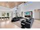 Open-concept living room with modern furnishings, fireplace, and seamless flow to the dining area at 14106 Eliot Ave, Orlando, FL 32827