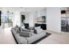 Modern open concept living room with comfortable seating and lots of natural light at 14106 Eliot Ave, Orlando, FL 32827