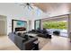 Open living room with fireplace, large sliders, and view of the backyard pool and patio at 14106 Eliot Ave, Orlando, FL 32827