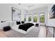 Bright and airy main bedroom with large windows, modern decor, and a minimalist aesthetic for a relaxing retreat at 14106 Eliot Ave, Orlando, FL 32827