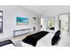 Sleek bedroom featuring a modern design, large windows, and minimalist decor, creating a serene and comfortable atmosphere at 14106 Eliot Ave, Orlando, FL 32827