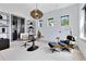 Modern office space with unique light fixture, contemporary desk, and ergonomic chair setup at 14106 Eliot Ave, Orlando, FL 32827