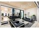 Open-concept patio with comfortable seating and access to a well-lit living space at 14106 Eliot Ave, Orlando, FL 32827
