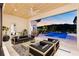 Inviting outdoor patio with pool view, perfect for evening relaxation and sunset viewing at 14106 Eliot Ave, Orlando, FL 32827