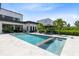 Beautiful backyard pool with lounge chairs, tropical landscaping, and a serene, relaxing ambiance at 14106 Eliot Ave, Orlando, FL 32827