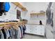Spacious walk-in closet provides ample storage with racks, shelving, and a dresser at 14106 Eliot Ave, Orlando, FL 32827