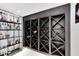 Stylish wine cellar featuring a dark wood wine rack, and a display for liquor and glasses at 14106 Eliot Ave, Orlando, FL 32827