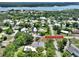 Beautiful aerial view of a charming home near the river with lush green trees and neighborhood at 1510 Live Oak St, New Smyrna Beach, FL 32168